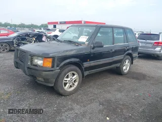 1999 Land Rover Range Rover z VIN SALPV1440XA412936, wystawiony jako IAAI lot #42271704 z przebiegiem 156 881 mil mil oraz . Historia ofert i sprzedaży dostępna na DreamBid. Obrazek 2.