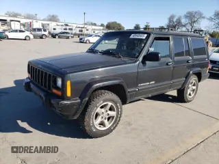 1999 Jeep Cherokee Sport z VIN 1J4FF68S1XL600711, wystawiony jako Copart lot #48440405 z przebiegiem 165 973 mil mil oraz Czysty tytuł • Clean title. Historia ofert i sprzedaży dostępna na DreamBid. Obrazek 1.
