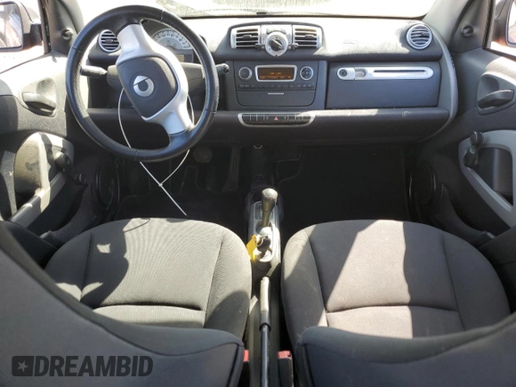 2014 Smart fortwo Pure z VIN WMEEJ3BA1EK753320, wystawiony jako Copart lot #55665555 z przebiegiem 71 305 mil mil oraz Szkody całkowita. Historia ofert i sprzedaży dostępna na DreamBid. Obrazek 8.