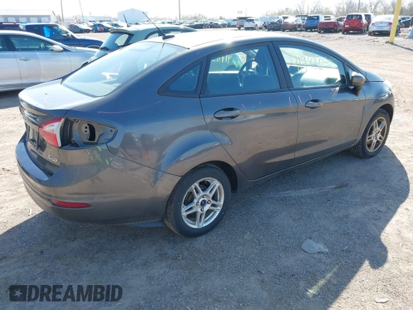 2017 Ford Fiesta SE with VIN 3FADP4BJ0HM117117, listed as a IAAI auction lot 41983052 with 99,186 mi miles. Bid and sale history available at carsss.com. Image 4.