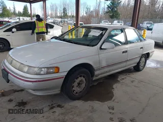 1992 Mercury Sable z VIN 1MECM5049NG647978, wystawiony jako IAAI lot #41805346 z przebiegiem 23 634 mil mil oraz . Historia ofert i sprzedaży dostępna na DreamBid. Obrazek 2.