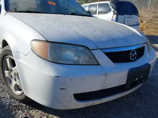 2001 Mazda Protege LX with VIN JM1BJ225710406286, listed as a IAAI auction lot 41887127 with Not Provided miles and . Bid and sale history available at DreamBid. Image 13.