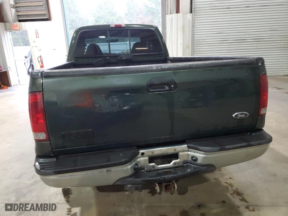 2000 Ford Super Duty F-250 XL with VIN 1FTNX20F1YED20251, listed as a Copart auction lot 79762464 with 306,364 mi miles and Salvage Title. Bid and sale history available at carsss.com. Image 6.