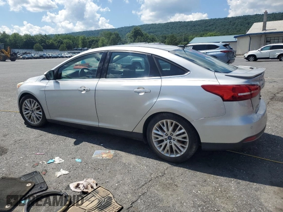 2015 Ford Focus Titanium with VIN 1FADP3J27FL267339, listed as a Copart auction lot 63395835 with 73,372 mi miles and Salvage title. Bid and sale history available at DreamBid. Image 2.