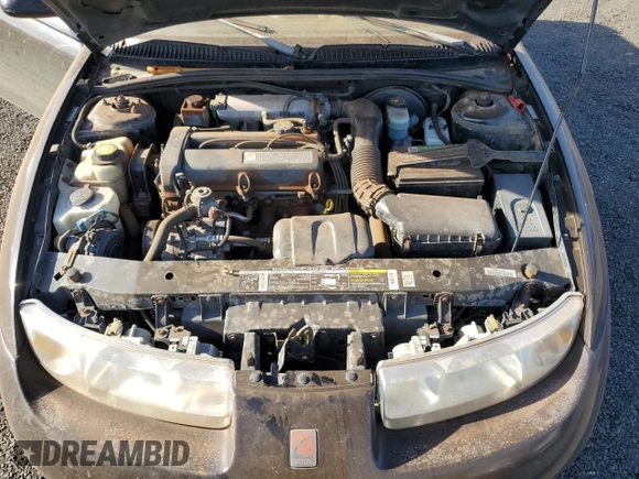 1999 Saturn SC z VIN 1G8ZR1274XZ262181, wystawiony jako Copart lot #75931774 z przebiegiem Nie podano mil oraz Szkoda całkowita • Salvage title. Historia ofert i sprzedaży dostępna na DreamBid. Obrazek 11.