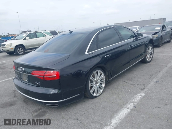2015 Audi A8 L 4.0T with VIN WAU32AFD4FN033471, listed as a IAAI auction lot 42120112 with 174,882 mi miles. Bid and sale history available at carsss.com. Image 4.