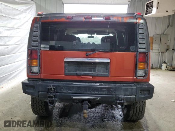 2003 Hummer H2 z VIN 5GRGN23U93H138182, wystawiony jako Copart lot #51842085 z przebiegiem 170 659 mil mil oraz Tytuł czysty. Historia ofert i sprzedaży dostępna na DreamBid. Obrazek 6.