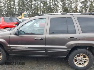 1999 Jeep Grand Cherokee Limited with VIN 1J4GW68N7XC739479, listed as a IAAI auction lot 41448323 with 129,840 mi miles. Bid and sale history available at carsss.com. Image 14.