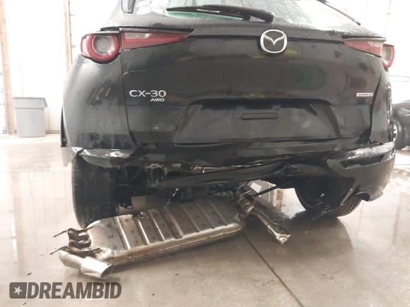 2021 Mazda CX-30 S with VIN 3MVDMBAL2MM265207, listed as a IAAI auction lot 41566325 with 62,587 mi miles and . Bid and sale history available at carsss.com. Image 6.