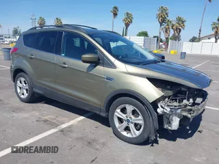 2013 Ford Escape SE with VIN 1FMCU0G99DUC05901, listed as a IAAI auction lot 42194672 with 121,435 mi miles and . Bid and sale history available at DreamBid. Image 1.