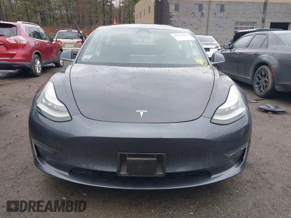 2019 Tesla Model 3 Mid Range with VIN 5YJ3E1EA3KF307415, listed as a IAAI auction lot 41673239 with 42,895 mi miles and . Bid and sale history available at DreamBid. Image 12.