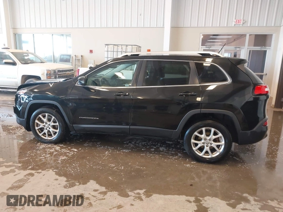 2015 Jeep Cherokee Latitude with VIN 1C4PJLCB9FW536767, listed as a IAAI auction lot 41380122 with 192,535 mi miles. Bid and sale history available at carsss.com. Image 14.