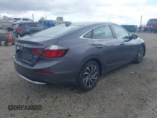 2021 Honda Insight Touring with VIN 19XZE4F91ME005517, listed as a IAAI auction lot 42036493 with 65,404 mi miles and . Bid and sale history available at carsss.com. Image 4.