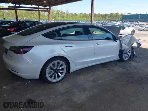 2022 Tesla Model 3 Long Range z VIN 5YJ3E1EB1NF192570, wystawiony jako IAAI lot #42230750 z przebiegiem 63 462 mil mil oraz . Historia ofert i sprzedaży dostępna na DreamBid. Obrazek 4.