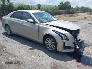 2014 Cadillac CTS Luxury RWD z VIN 1G6AR5SX4E0141195, wystawiony jako IAAI lot #42144565 z przebiegiem 80 267 mil mil oraz . Historia ofert i sprzedaży dostępna na DreamBid. Obrazek 1.