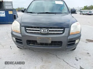 2007 Kia Sportage LX with VIN KNDJE723077397667, listed as a IAAI auction lot 42011122 with 218,744 mi miles and . Bid and sale history available at carsss.com. Image 6.