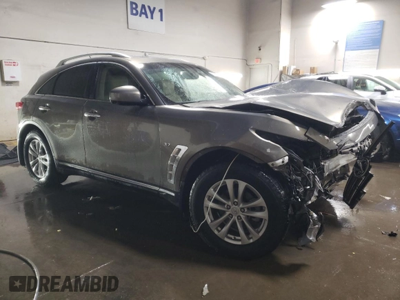 2014 Infiniti QX70 z VIN JN8CS1MW5EM412429, wystawiony jako Copart lot #82933934 z przebiegiem Nie podano mil oraz Szkoda całkowita • Salvage title. Historia ofert i sprzedaży dostępna na DreamBid. Obrazek 4.
