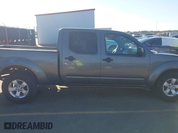 2009 Nissan Frontier LE with VIN 1N6AD09U79C402623, listed as a IAAI auction lot 41656385 with 286,777 mi miles and . Bid and sale history available at DreamBid. Image 13.