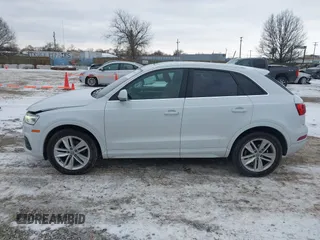 2017 Audi Q3 Premium Plus z VIN WA1JCCFS6HR008921, wystawiony jako IAAI lot #41351675 z przebiegiem 117 158 mil mil oraz . Historia ofert i sprzedaży dostępna na DreamBid. Obrazek 14.