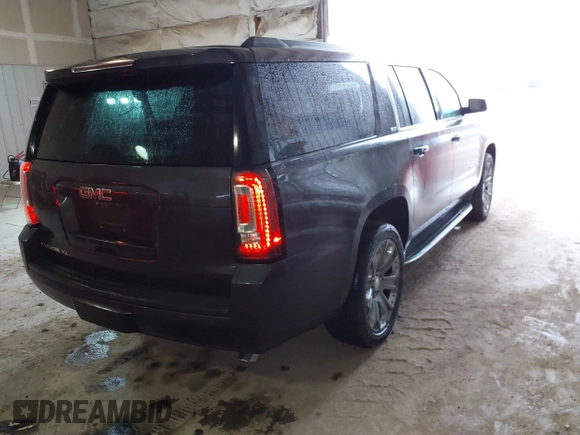 2015 GMC Yukon XL SLT with VIN 1GKS2HKC6FR667110, listed as a IAAI auction lot 41472250 with 141,383 mi miles. Bid and sale history available at carsss.com. Image 4.