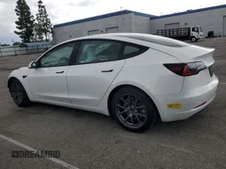 2021 Tesla Model 3 Standard Range Plus with VIN 5YJ3E1EA6MF066064, listed as a Copart auction lot 54063625 with 27,424 mi miles and Salvage Title. Bid and sale history available at DreamBid. Image 2.