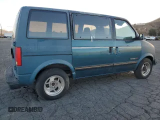 1986 GMC Safari z VIN 1GDDM15Z1GB521872, wystawiony jako Copart lot #87655995 z przebiegiem 30 889 mil mil oraz Szkody całkowita. Historia ofert i sprzedaży dostępna na DreamBid. Obrazek 3.