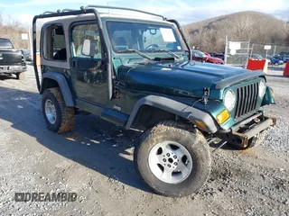 2000 Jeep Wrangler Sahara with VIN 1J4FA59S0YP724521, listed as a IAAI auction lot 41574689 with 167,584 mi miles. Bid and sale history available at carsss.com. Image 1.