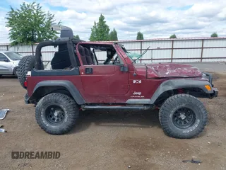 2003 Jeep Wrangler X z VIN 1J4FA39S73P349014, wystawiony jako IAAI lot #42582747 z przebiegiem 50 525 mil mil oraz . Historia ofert i sprzedaży dostępna na DreamBid. Obrazek 14.