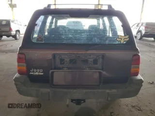 1995 Jeep Grand Cherokee Laredo with VIN 1J4GZ58S1SC704775, listed as a Copart auction lot 87556535 with 266,365 mi miles and Salvage Title. Bid and sale history available at carsss.com. Image 6.
