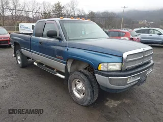 2002 Dodge Ram 2500 with VIN 3B7KF236X2M293084, listed as a IAAI auction lot 41876449 with 164,418 mi miles. Bid and sale history available at carsss.com. Image 1.