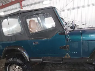 1995 Jeep Wrangler S with VIN 1J4FY19P0SP262341, listed as a IAAI auction lot 41672136 with 161,979 mi miles. Bid and sale history available at carsss.com. Image 13.