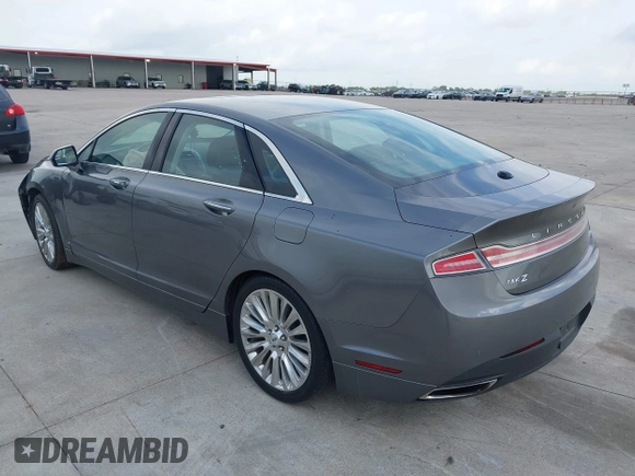 2014 Lincoln MKZ z VIN 3LN6L2G99ER834840, wystawiony jako IAAI lot #42134656 z przebiegiem 33 565 mil mil oraz . Historia ofert i sprzedaży dostępna na DreamBid. Obrazek 3.