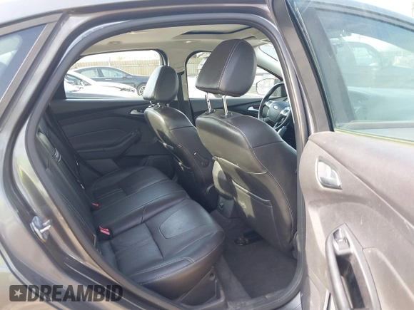 2013 Ford Focus SE with VIN 1FADP3F22DL117712, listed as a IAAI auction lot 42131439 with 124,327 mi miles. Bid and sale history available at carsss.com. Image 8.