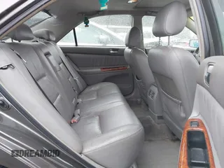 2004 Toyota Camry LE with VIN JTDBF32K740152841, listed as a IAAI auction lot 41808909 with 142,611 mi miles. Bid and sale history available at carsss.com. Image 8.
