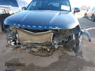 2022 Kia Telluride LX z VIN 5XYP2DHC9NG214968, wystawiony jako IAAI lot #41329588 z przebiegiem 59 141 mil mil oraz . Historia ofert i sprzedaży dostępna na DreamBid. Obrazek 6.