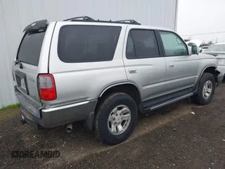 1999 Toyota 4Runner SR5 with VIN JT3HN86RXX0232435, listed as a IAAI auction lot 41473618 with 267,054 mi miles and . Bid and sale history available at DreamBid. Image 4.