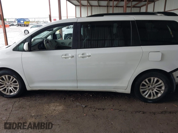 2014 Toyota Sienna XLE with VIN 5TDYK3DC6ES444121, listed as a IAAI auction lot 42110190 with 240,366 mi miles and . Bid and sale history available at DreamBid. Image 14.