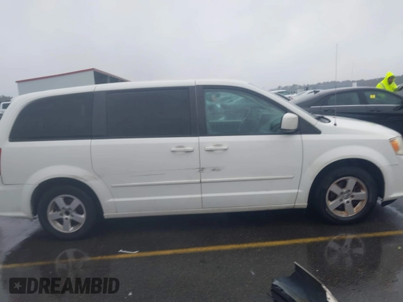 2012 Dodge Grand Caravan SXT with VIN 2C4RDGCG4CR304472, listed as a IAAI auction lot 41396437 with 180,309 mi miles and . Bid and sale history available at DreamBid. Image 13.