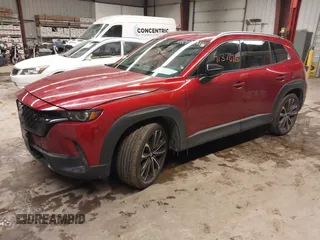 2023 Mazda CX-50 S Premium Plus with VIN 7MMVABEM8PN105411, listed as a IAAI auction lot 41378915 with 34,866 mi miles and . Bid and sale history available at DreamBid. Image 2.