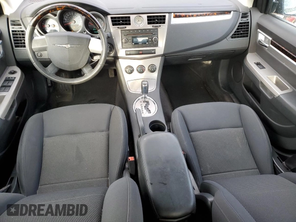 2010 Chrysler Sebring Limited with VIN 1C3CC5FB2AN120496, listed as a Copart auction lot 82131024 with 106,563 mi miles and Salvage Title. Bid and sale history available at carsss.com. Image 8.