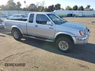 2000 Nissan Frontier XE with VIN 1N6ED26T1YC327635, listed as a Copart auction lot 43149525 with 922,578 mi miles and Salvage title. Bid and sale history available at DreamBid. Image 4.