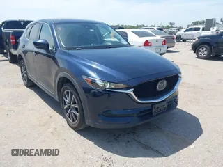 2018 Mazda CX-5 Touring z VIN JM3KFACM7J1410275, wystawiony jako IAAI lot #42248830 z przebiegiem 101 125 mil mil oraz . Historia ofert i sprzedaży dostępna na DreamBid. Obrazek 1.