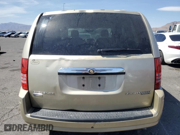 2010 Chrysler Town & Country LX with VIN 2A4RR4DE0AR188949, listed as a Copart auction lot 54140515 with 185,534 mi miles and Salvage Title. Bid and sale history available at DreamBid. Image 6.