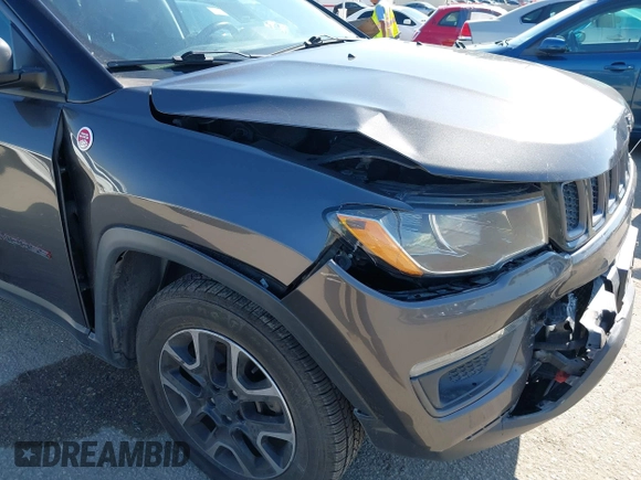 2019 Jeep Compass Trailhawk with VIN 3C4NJDDB3KT759849, listed as a IAAI auction lot 42141467 with 100,915 mi miles and . Bid and sale history available at DreamBid. Image 6.