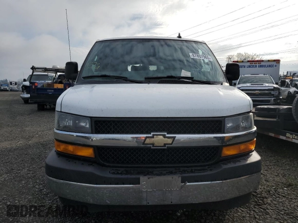 2018 Chevrolet Express Passenger LT with VIN 1GAZGPFG3J1245055, listed as a Copart auction lot 87807965 with 106,634 mi miles and Salvage title. Bid and sale history available at DreamBid. Image 5.