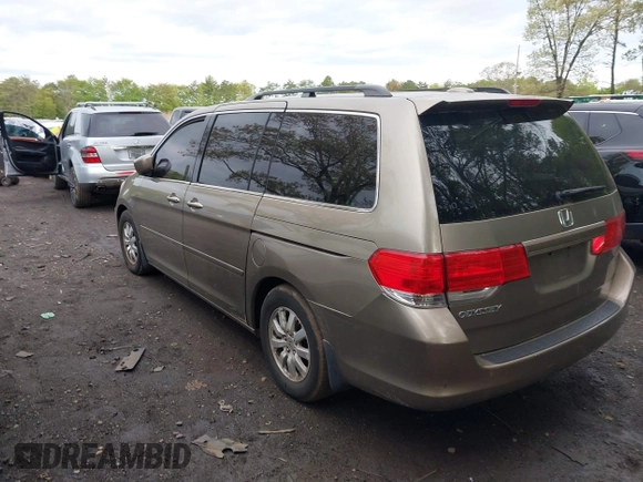 2009 Honda Odyssey EX-L with VIN 5FNRL38759B022866, listed as a IAAI auction lot 42200965 with 145,641 mi miles and . Bid and sale history available at DreamBid. Image 3.