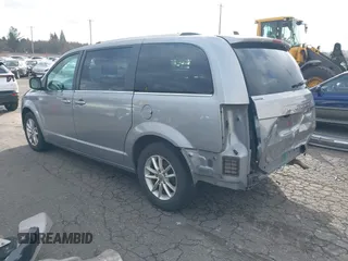 2019 Dodge Grand Caravan SXT with VIN 2C4RDGCG0KR786940, listed as a IAAI auction lot 41648332 with 96,427 mi miles and . Bid and sale history available at DreamBid. Image 3.
