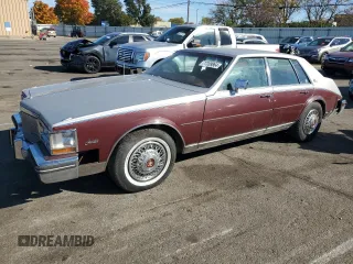 1984 Cadillac Seville z VIN 1G6AS6984EE826325, wystawiony jako Copart lot #77209864 z przebiegiem 26 366 mil mil oraz Tytuł czysty. Historia ofert i sprzedaży dostępna na DreamBid. Obrazek 1.