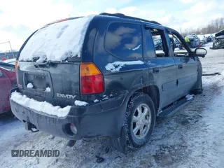 2004 GMC Envoy SLE with VIN 1GKDT13S242426816, listed as a IAAI auction lot 41566269 with 1 mi miles. Bid and sale history available at carsss.com. Image 4.