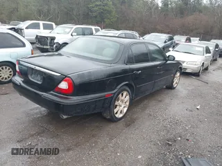2004 Jaguar XJ with VIN SAJEA71C34SG10171, listed as a IAAI auction lot 41412081 with 150,488 mi miles. Bid and sale history available at carsss.com. Image 4.